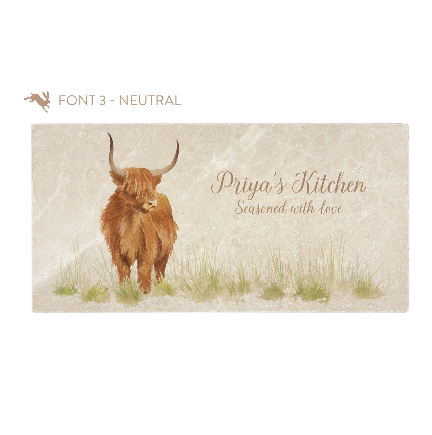 A personalised rectangular marble sharing platter featuring a highland cow in a watercolour style. The example personalised neutral colour text reads ‘Priya's Kitchen Seasoned with love’ in a brush script font.