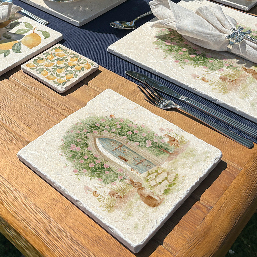 A square medium marble platter featuring a watercolour scene of animals showing the way to a hidden door leading to a secret garden.