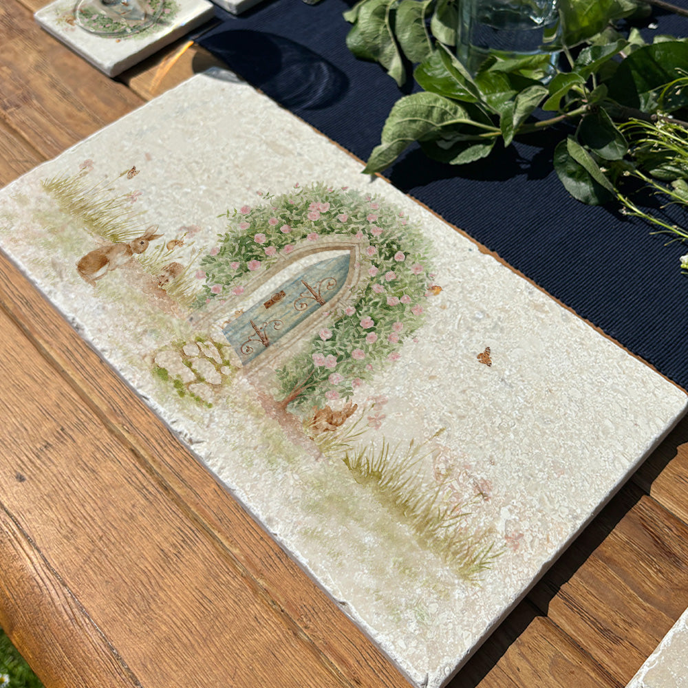 A rectangle marble sharing platter with a watercolour scene showing a hidden door under a rose archway leading to a secret garden.
