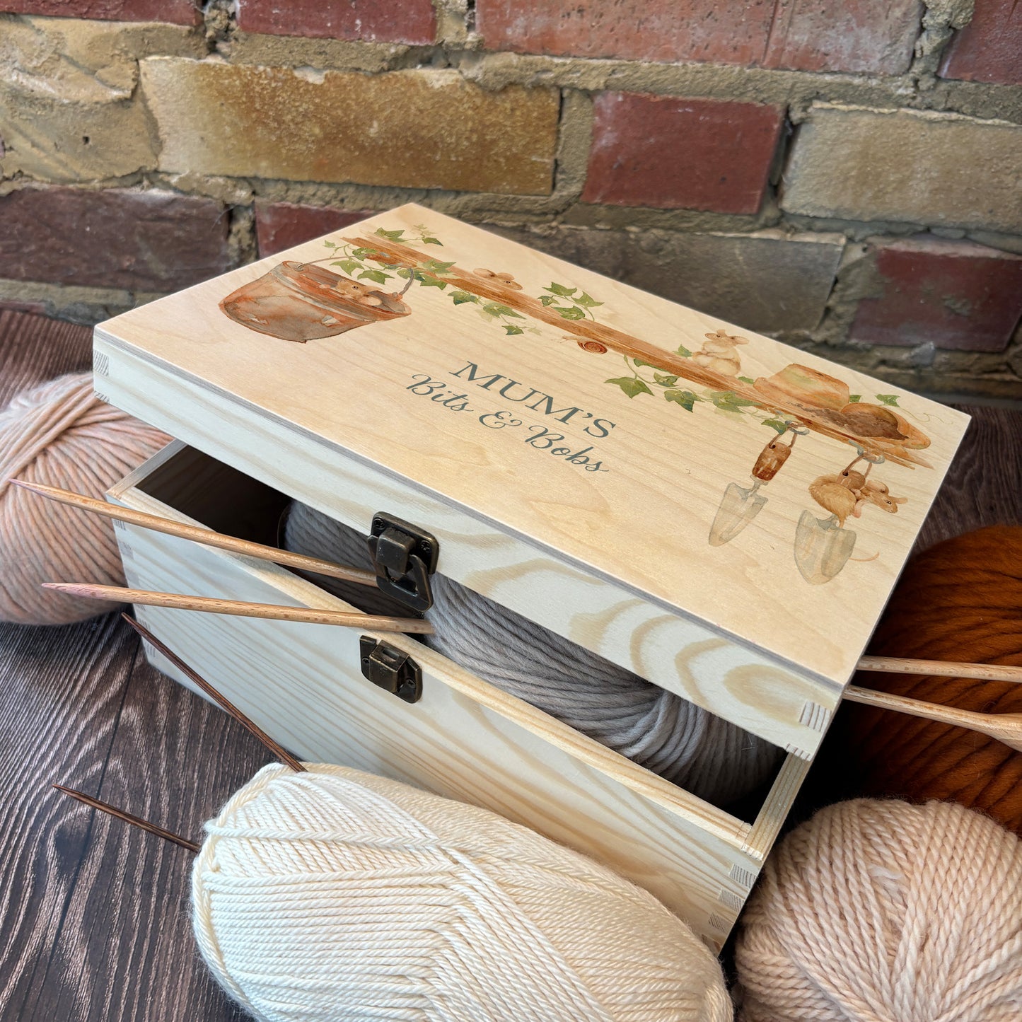 Medium wooden pine gift box, The perfect Personalised keepsake, memory box, storage box with  some mischievous mice playing on a wooden shelf filled with gardening tools and plant pots, there is also a small snail on the shelf. The design  features our classic gentle watercolour style. storage solutions, easy stacker, memorabilia