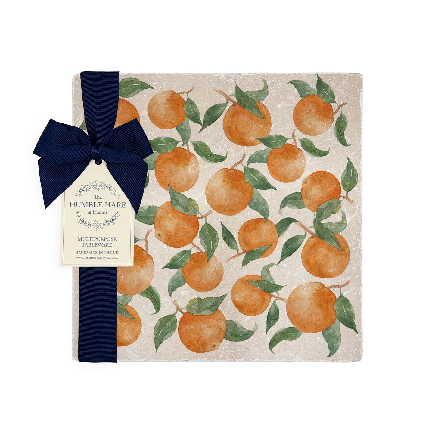 A medium square multipurpose marble platter, featuring a watercolour design with a pattern of oranges with leaves.