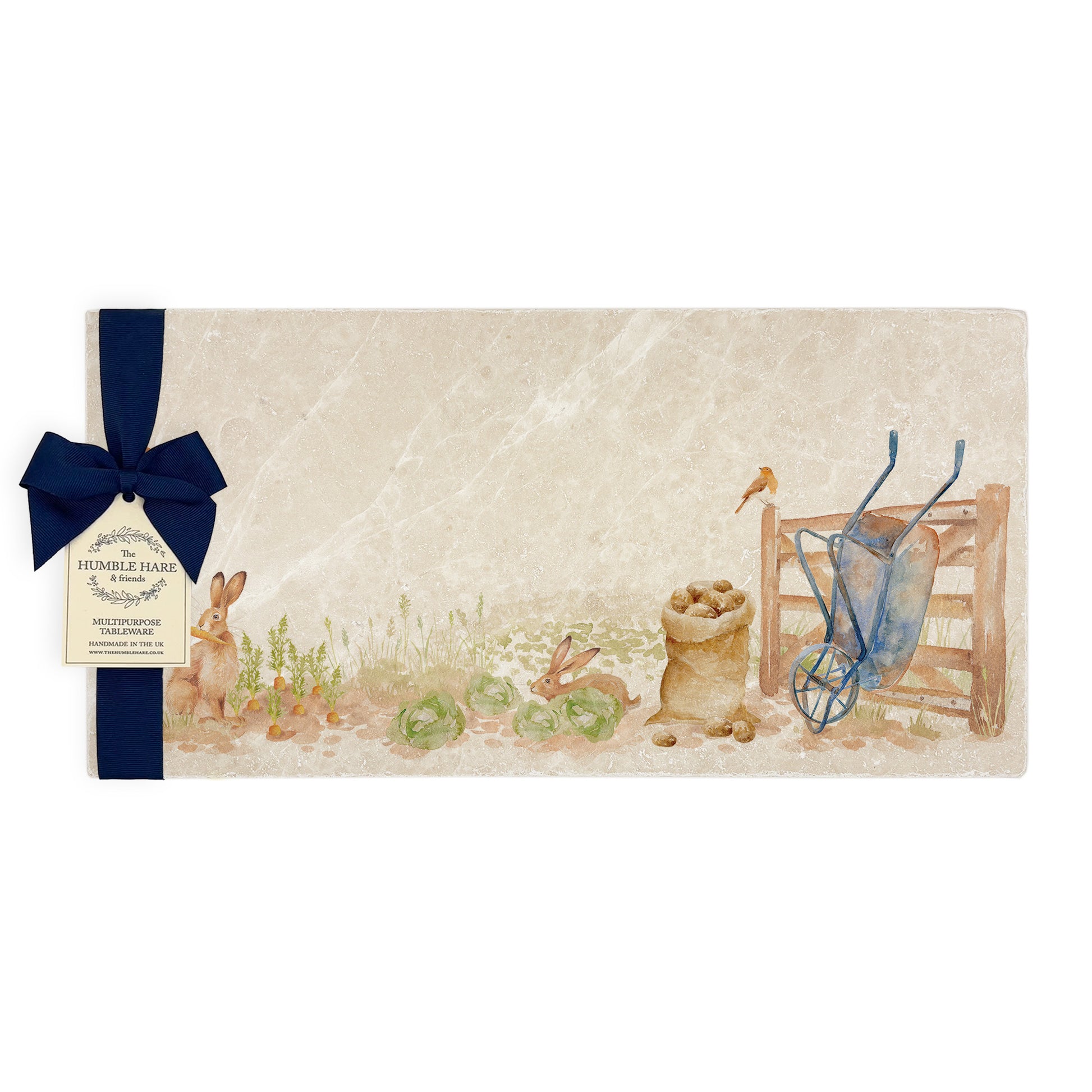 A handmade cream marble sharing platter with a watercolour vegetable patch design, packaged with a luxurious dark blue bow and branded gift tag.