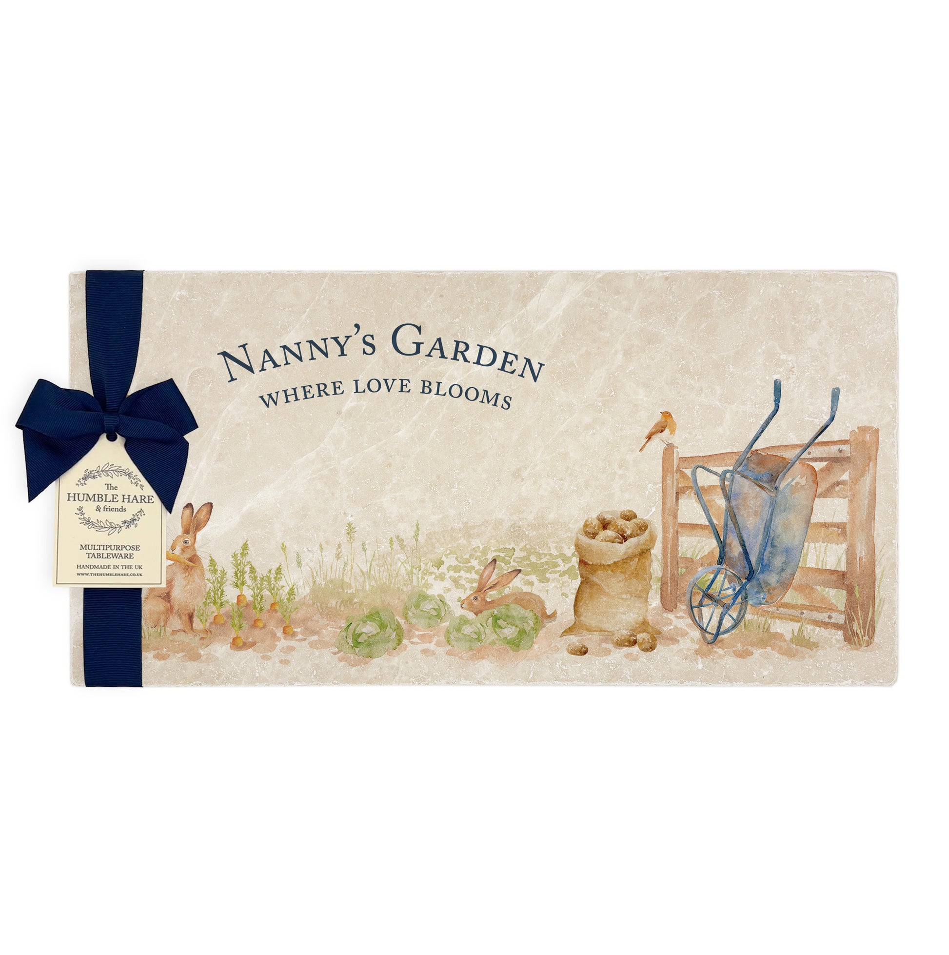 A personalised rectangular marble sharing platter featuring hares and robins in a vegetable patch in a watercolour style, packaged with a luxurious dark blue bow and branded gift tag.