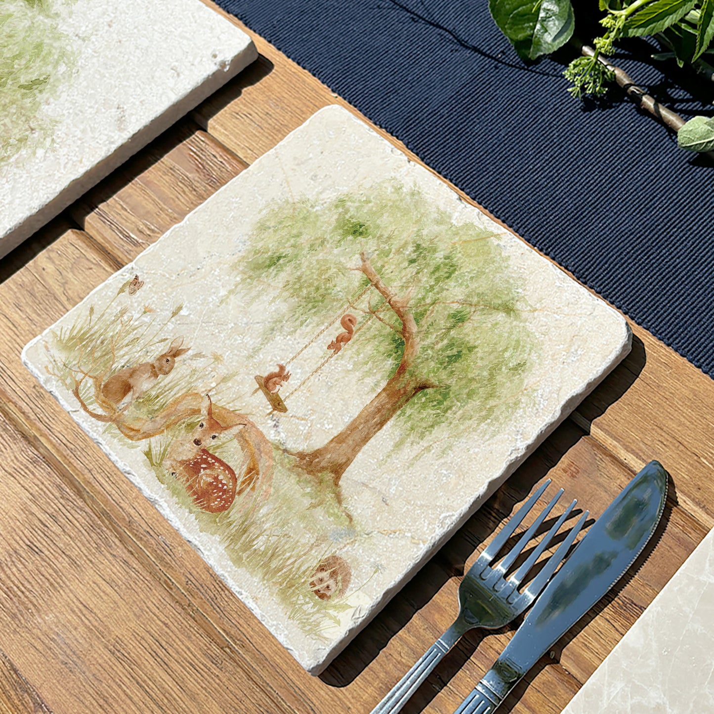 A handmade medium marble platter featuring a watercolour scene of woodland animals underneath a willow tree.