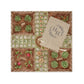 An allotment themed marble Ludo board with a cotton bag of wooden counters. The wooden counters are decorated with vegetables including a cabbage, carrot, radish and peas.