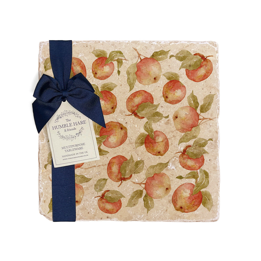 A medium multipurpose marble platter with a watercolour apple pattern, packaged with a luxurious dark blue bow and branded gift tag.