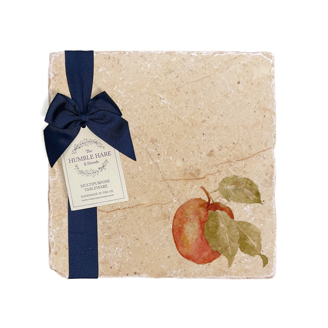 A medium multipurpose marble platter with a watercolour apple design, packaged with a luxurious dark blue bow and branded gift tag.