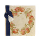 A large multipurpose marble platter with a watercolour apple wreath design, packaged with a luxurious dark blue bow and branded gift tag.