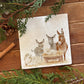 A square marble platter featuring a Nativity scene illustration with three donkeys, a sheep, and a lamb in a manger