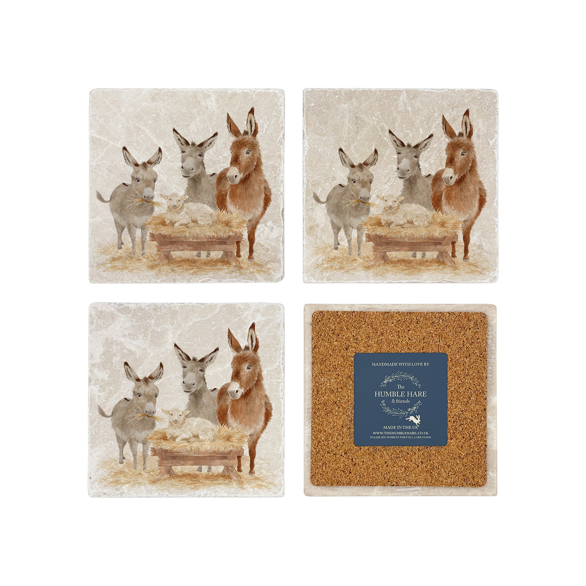 As set of four square marble coasters, each with a watercolour illustration of a nativity scene of donkeys and a lamb in a manger. One coaster in the set is flipped to show the cork back.