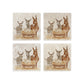 As set of four square marble coasters, each with a watercolour illustration of a nativity scene of donkeys and a lamb in a manger.