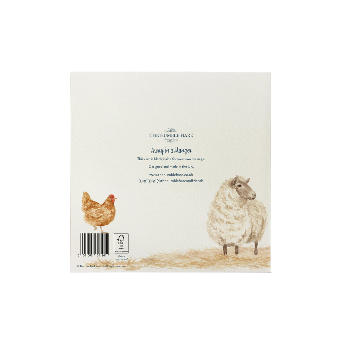The back of a 'The Humble Hare' Christmas card featuring a watercolour illustration of a brown hen and a white sheep on a cream background, with the text 'Away in a Manger' and a barcode.