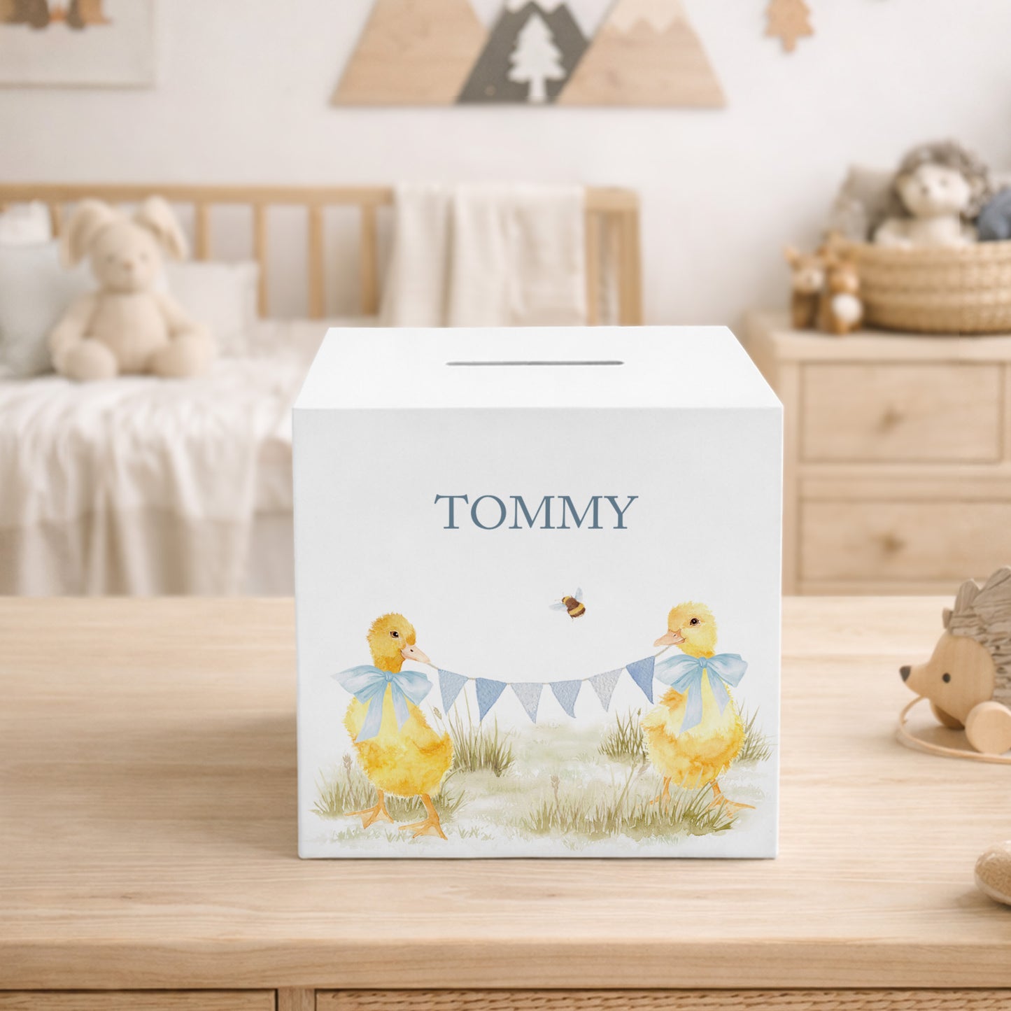 personalised handmade duckling money box in neutral childrens bedroom