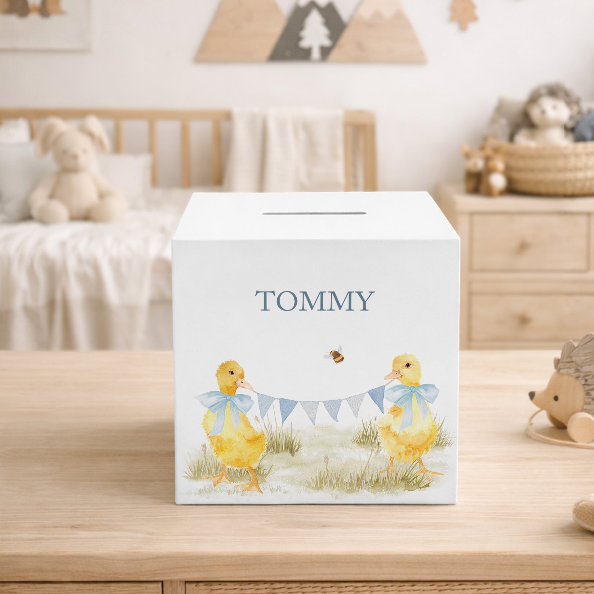 personalised handmade duckling money box in neutral childrens bedroom