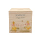 watercolour themed handmade money box for new baby nursery gift, yellow ducklings playing in the field , holding onto bunting with bows around their necks 