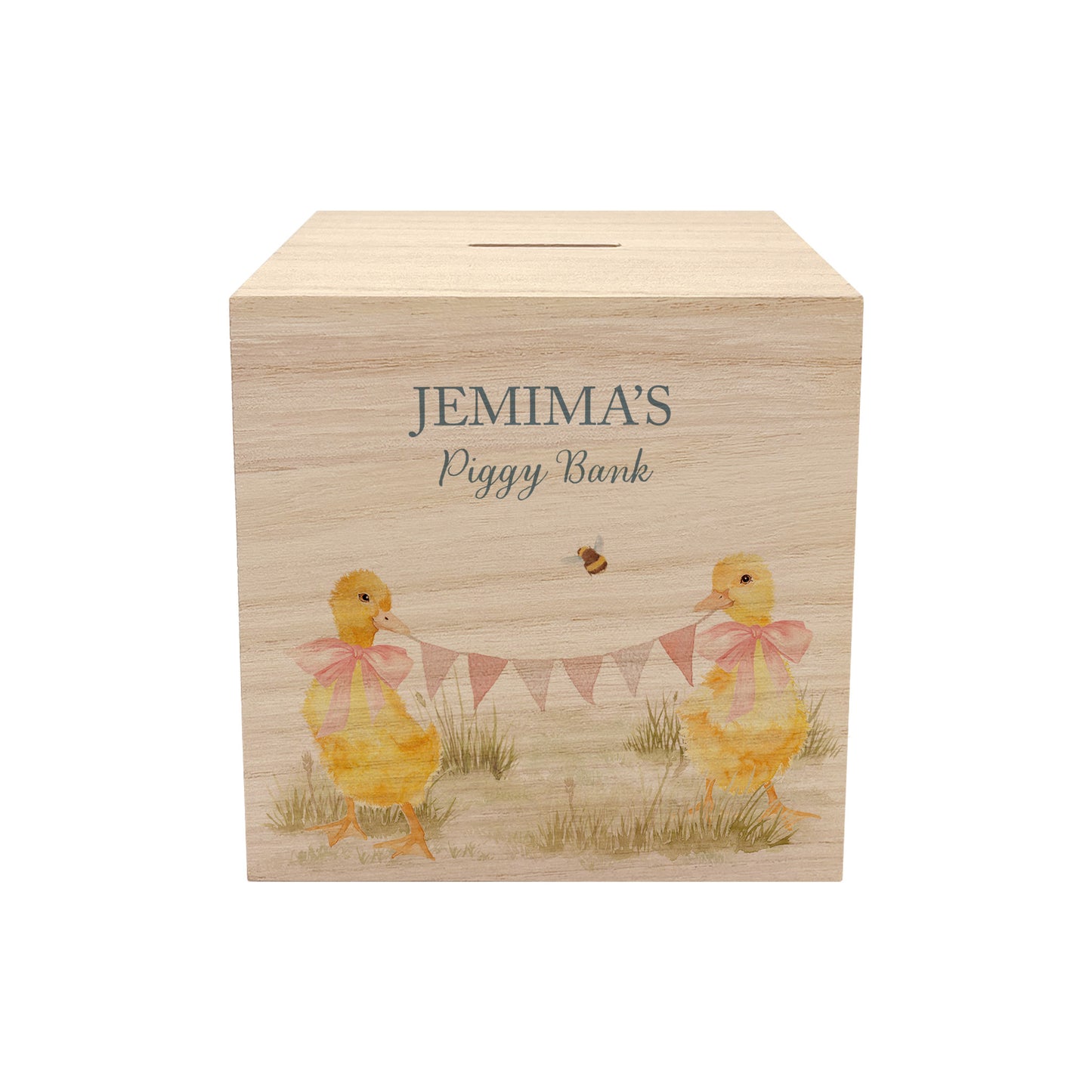 watercolour themed handmade money box for new baby nursery gift, yellow ducklings playing in the field , holding onto bunting with bows around their necks 