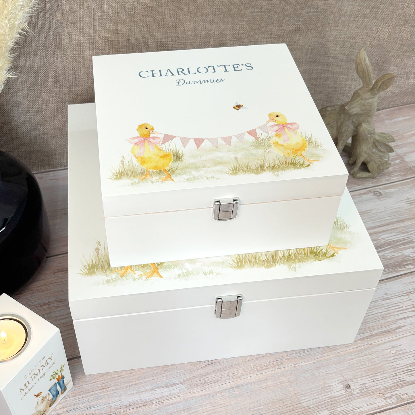 A white wooden keepsake box featuring a sweet baby ducklings design, personalised with custom text. Choose from two sizes, medium and large.