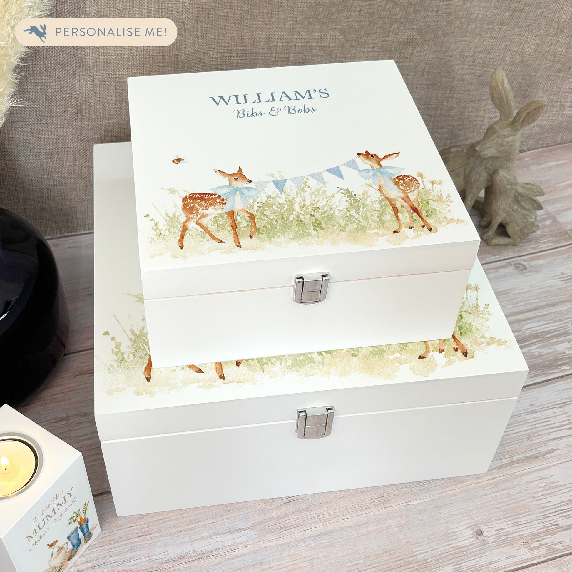 A white wooden keepsake box featuring a sweet baby fawns design, personalised with custom text. Choose from two sizes, medium and large.