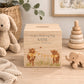 personalised watercolour money box handmade for christening keepsake, sweet highland cow babies playing in a field with bunting with bows around their necks