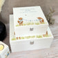 A white wooden keepsake box featuring a sweet baby highland cows design, personalised with custom text. Choose from two sizes, medium and large.