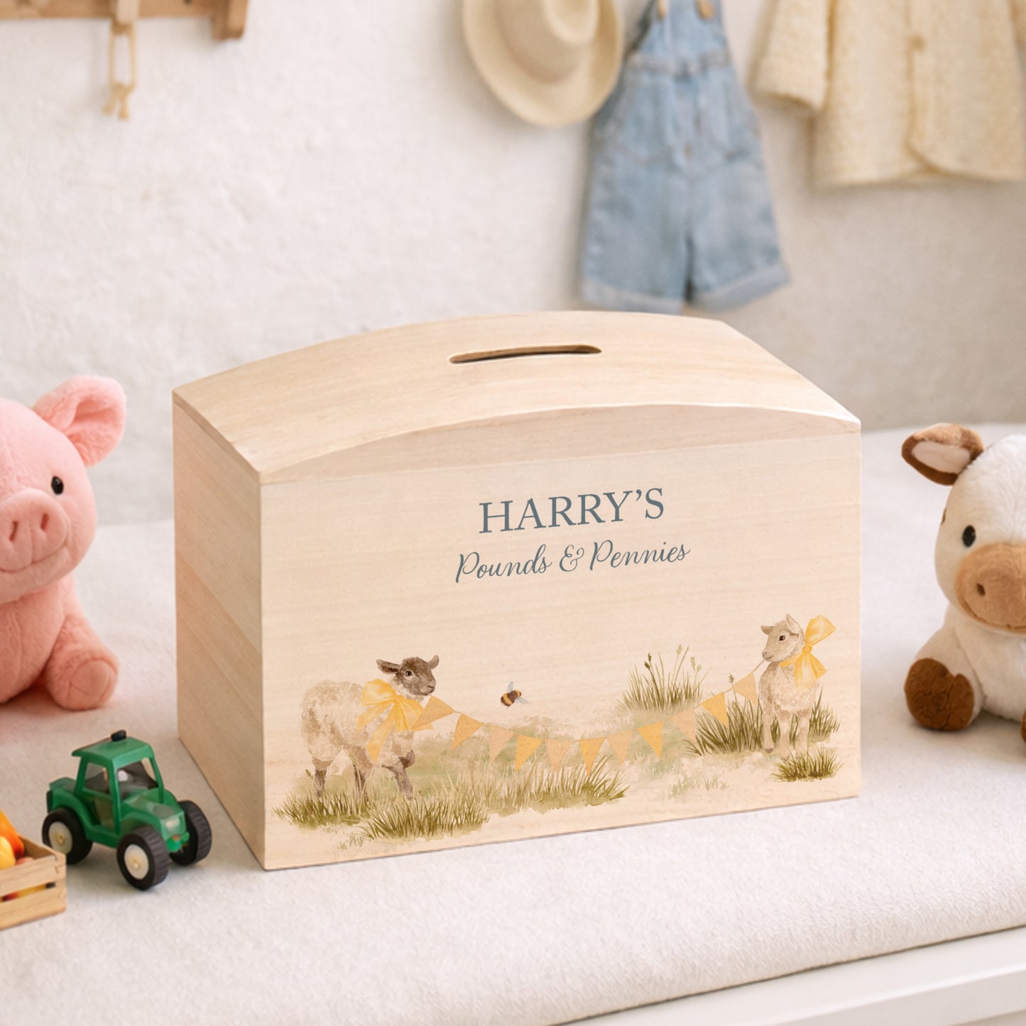 Baby Lambs playing with Bunting with bows on them, choice of Blue, Pink and yellow colour, the perfect money box for your little savers. Newborn, birthday and christening gift. 