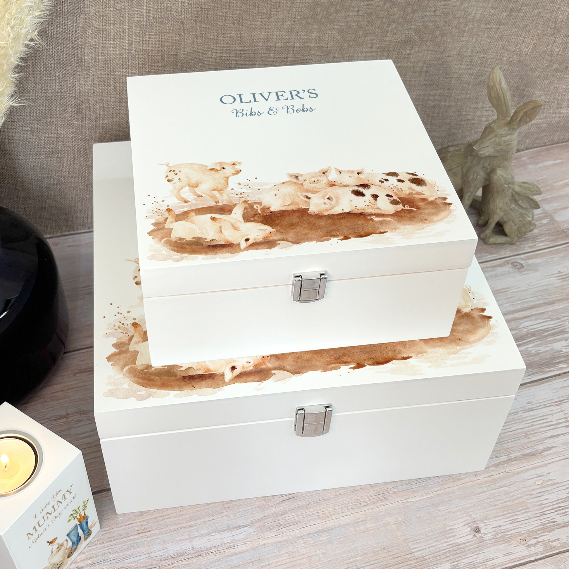 A white wooden keepsake box featuring a sweet baby piglets design, personalised with custom text. Choose from two sizes, medium and large.