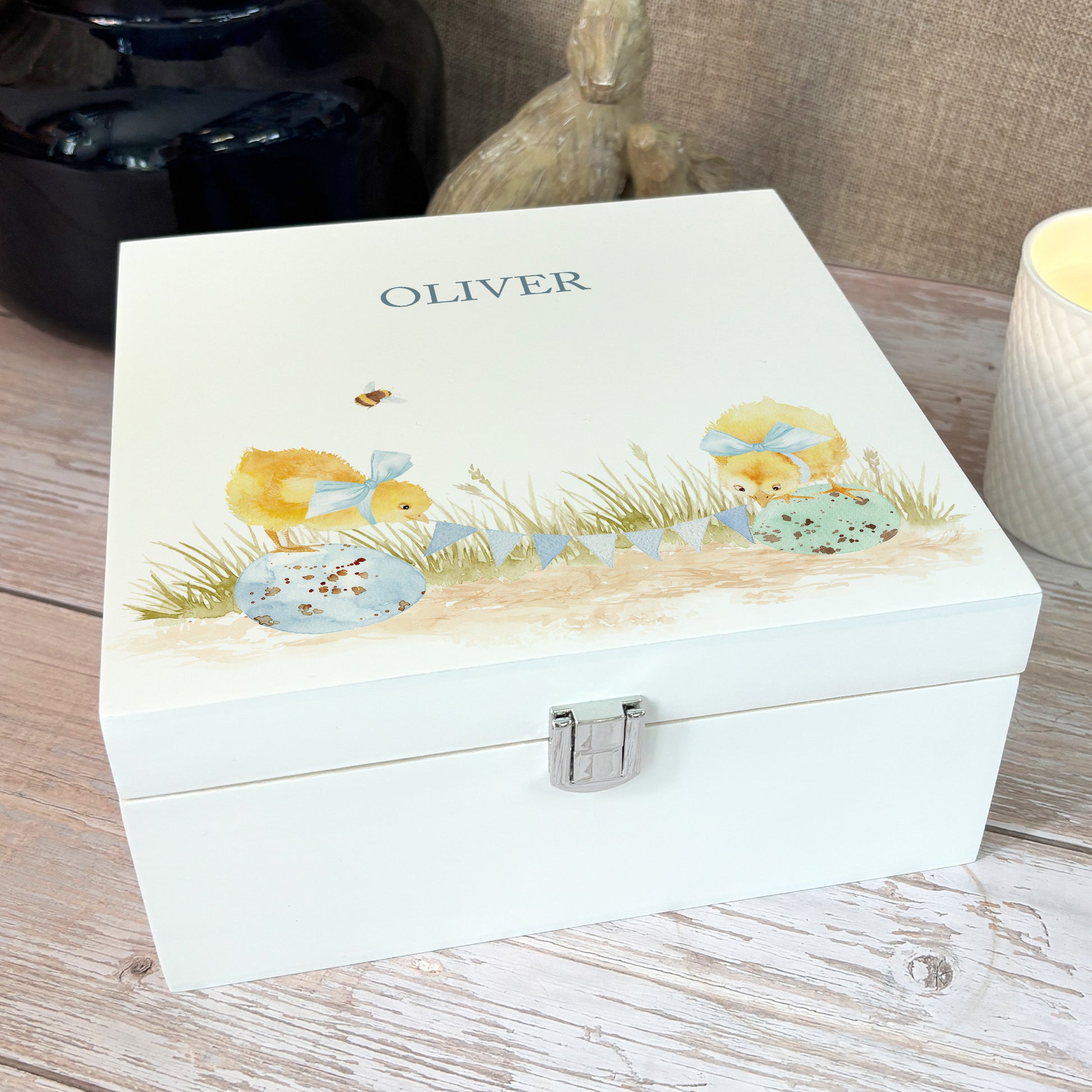 A white wooden keepsake box featuring a sweet baby chicks design. The box can be personalised with a name or special message, making it a truly unique and heartfelt gift for any occasion