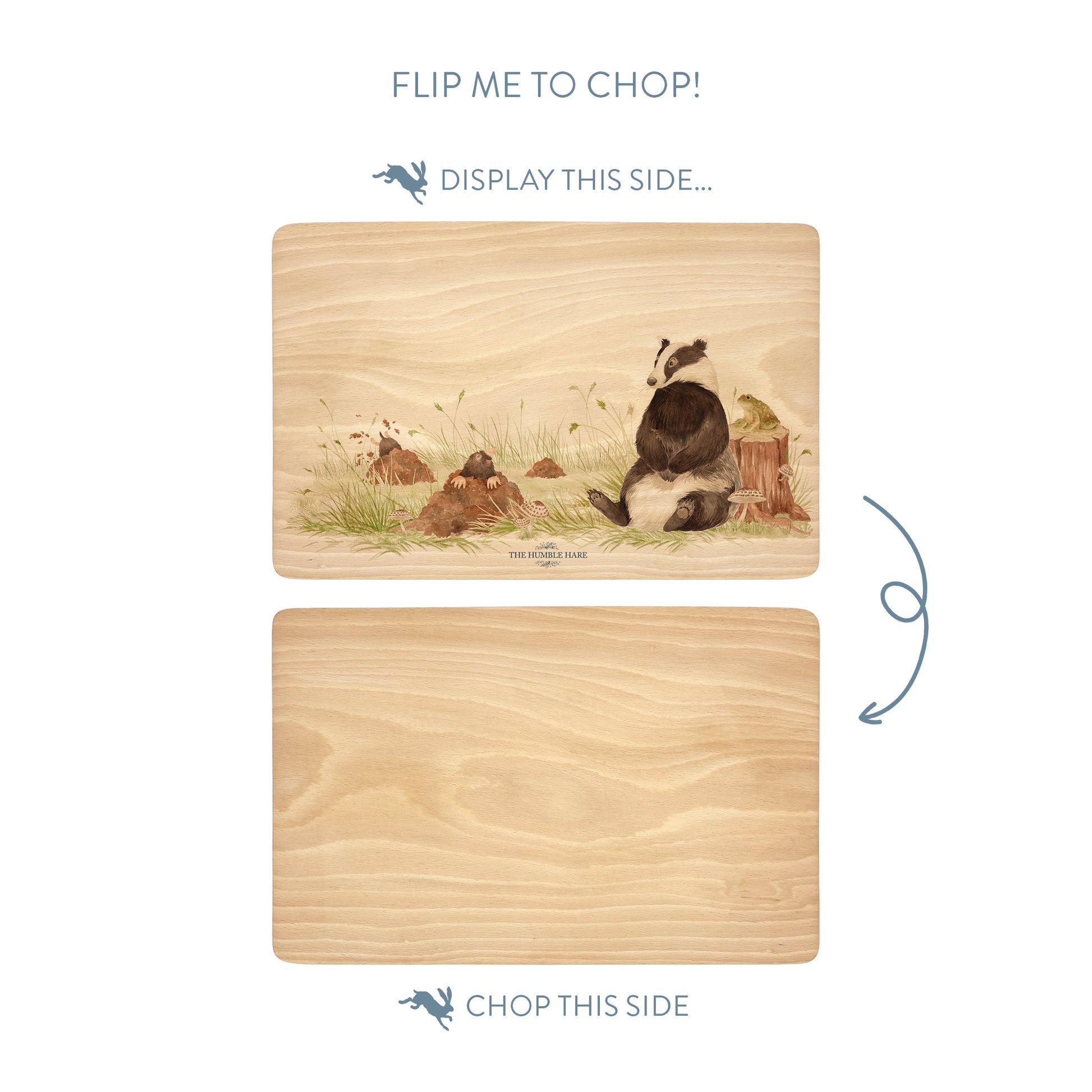 Wooden cutting board with a badger and mole illustration on one side and plain wood on the other, with text indicating which side to display and which to chop.