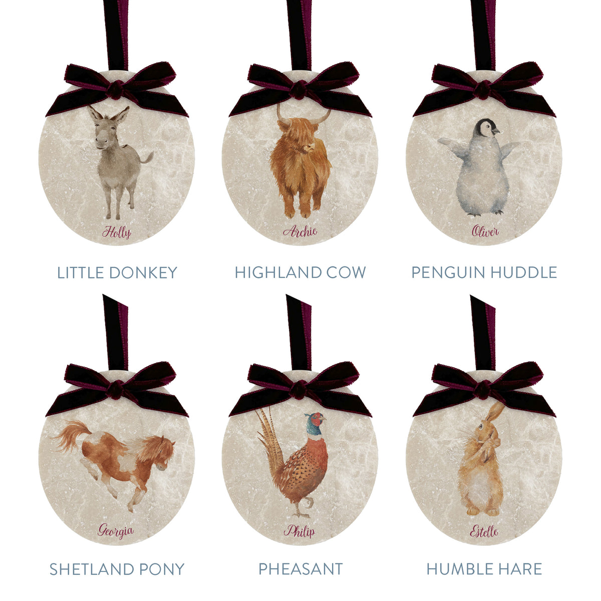 Six oval marble Christmas baubles showing the different design choices customers can choose from for their set. All of the baubles feature watercolour illustrations of countryside animals, and are finished with a luxurious velvet bow and hanging loop.