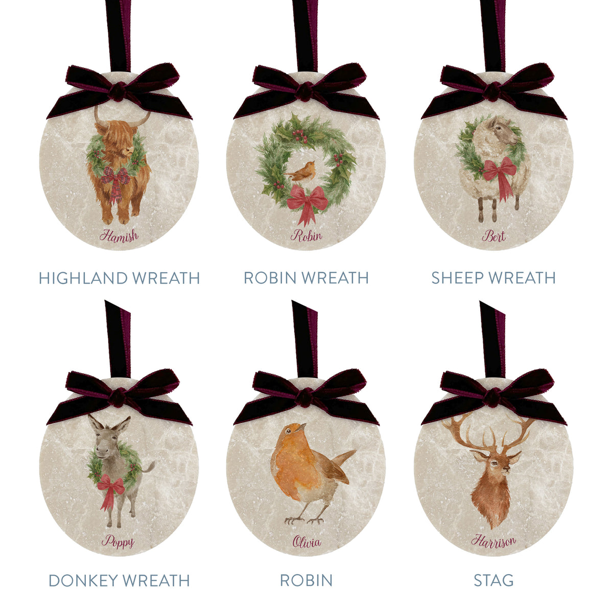 Six oval marble Christmas baubles showing the different design choices customers can choose from for their set. All of the baubles feature watercolour illustrations of countryside animals, and are finished with a luxurious velvet bow and hanging loop.