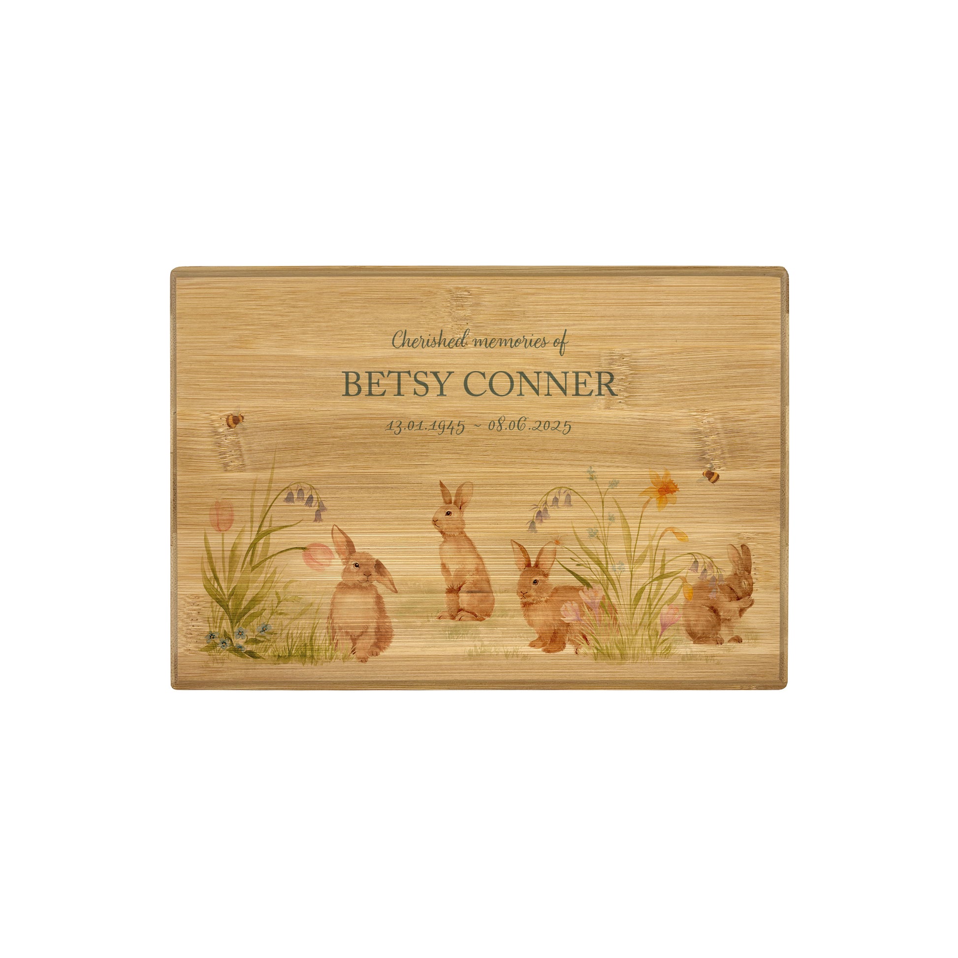 A beautifully crafted solid Bamboo wooden urn, finished with a soft watercolour design of bunnies in a spring flower meadow, Thoughtfully made for either display or burial, this personalised urn can be customised to create a meaningful memorial. Perfect for holding ashes of a loved one or a beloved pet, it serves as a comforting tribute and keepsake. 