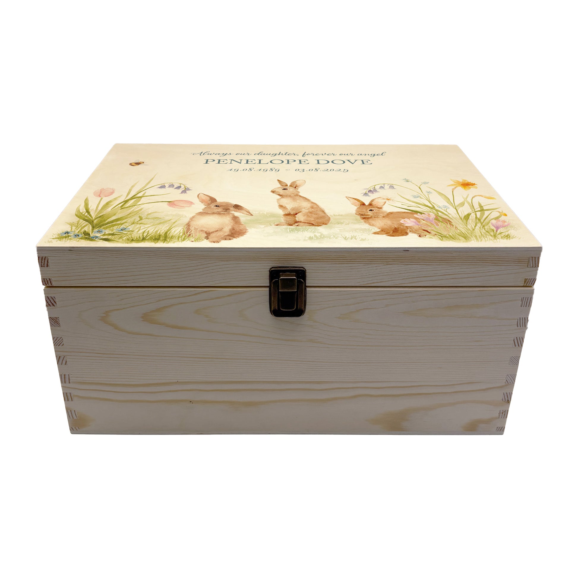 Wooden box with rabbit illustration on a wooden background. Wooden box with a decorative lid featuring animal illustrations on a wooden background. Perfect funeral memory keepsake box, for storing ashes, order of service, flowers, pictures. 
