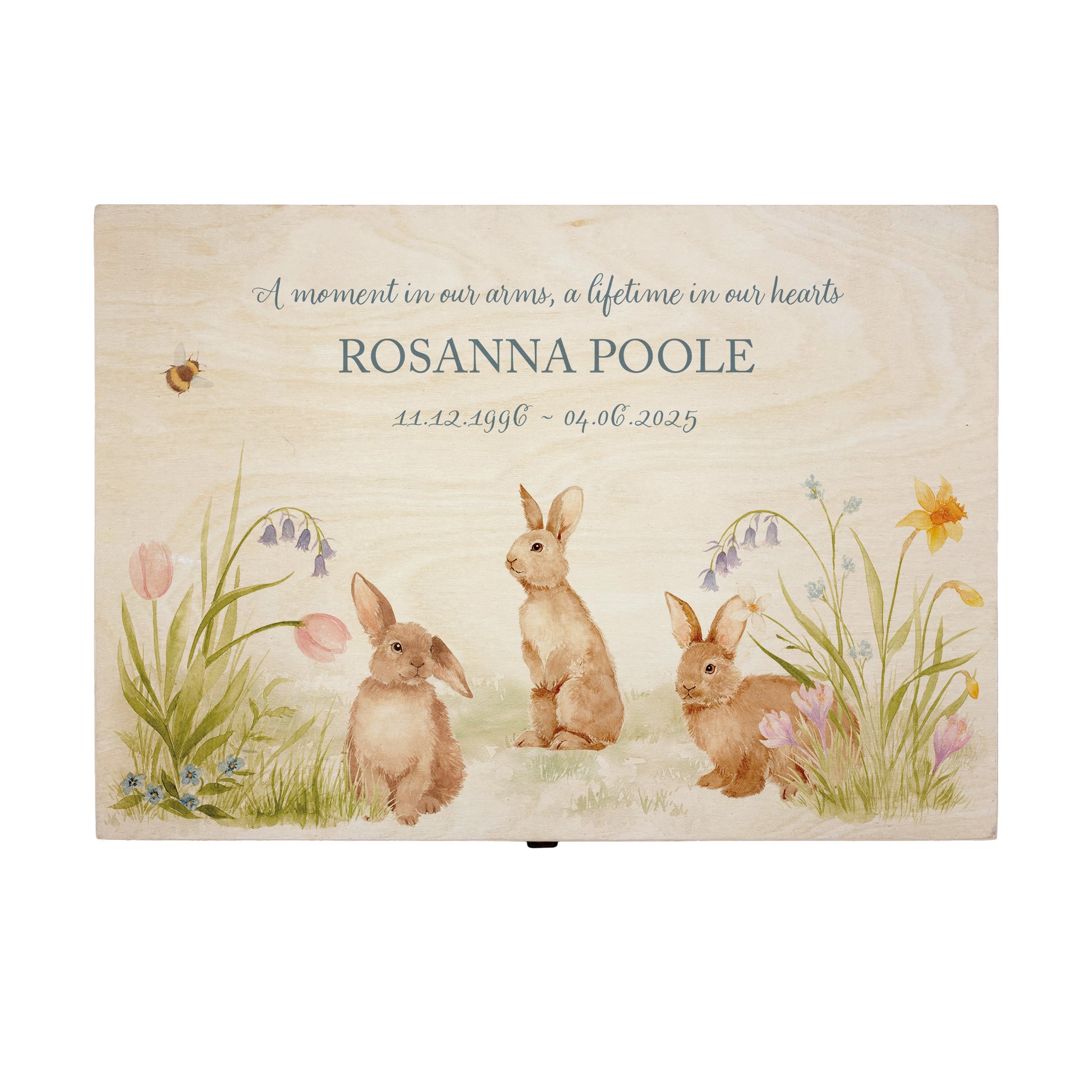 Wooden box with rabbit illustration on a wooden background. Wooden box with a decorative lid featuring animal illustrations on a wooden background. Perfect funeral memory keepsake box, for storing ashes, order of service, flowers, pictures. 