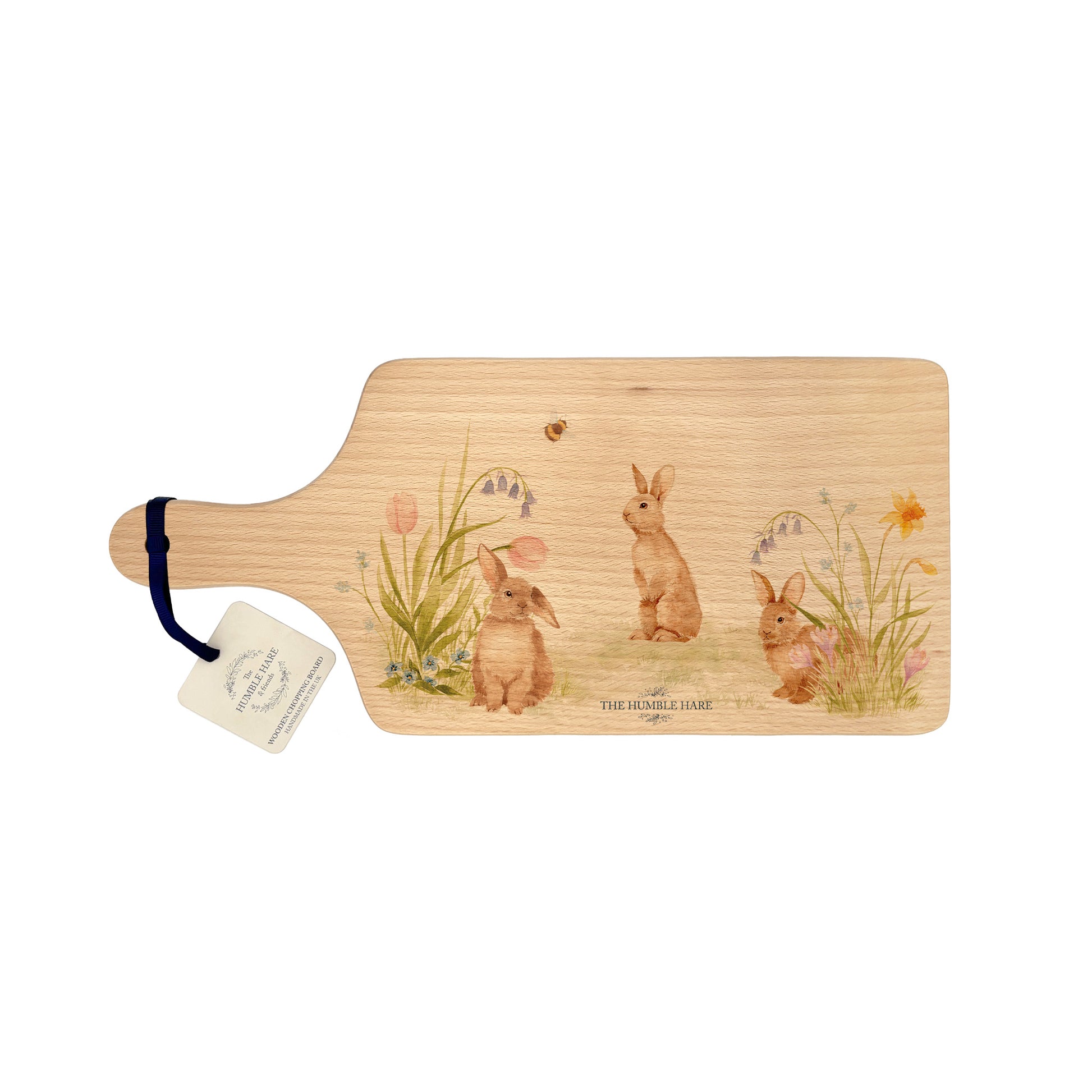 watercolour bunny design in a meadow. This watercolour design chopping board makes a great gift.  