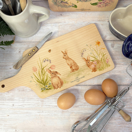 watercolour bunny design in a meadow. This watercolour design chopping board makes a great gift.  
