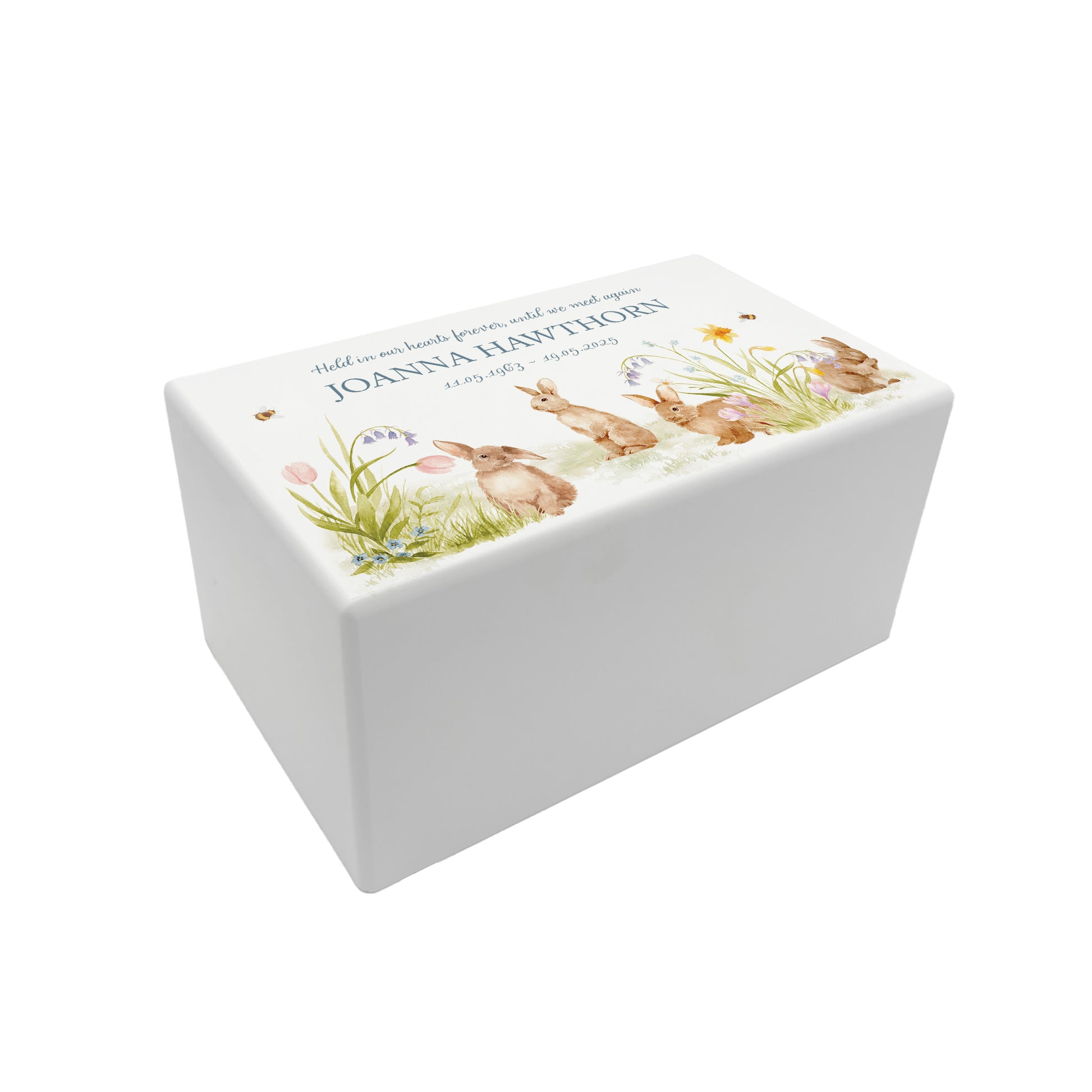 Luxury solid wooden white painted Urn ,  Featuring Bunnies in a flower meadow with buzzy bees, A watercolour illustration, our urns and Caskets for displaying or burying ashes. Customisable and can be personalised. Perfect funeral memory keepsake urn, for storing ashes for humans and pets. 