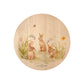 Round beech wood chopping board featuring our blooming bunnies woodland animal design, with rabbits among spring flowers.