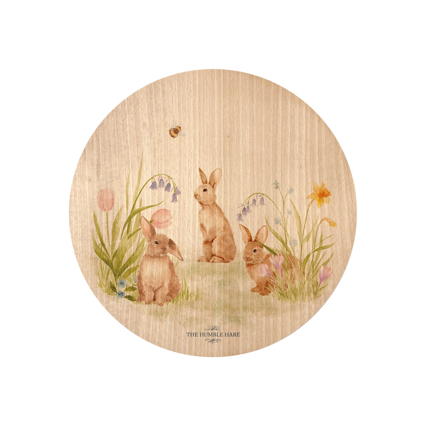 Round beech wood chopping board featuring our blooming bunnies woodland animal design, with rabbits among spring flowers.