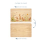 Wooden cutting board with a bunnies and flowers illustration on one side and plain wood on the other, with text indicating which side to display and which to chop.