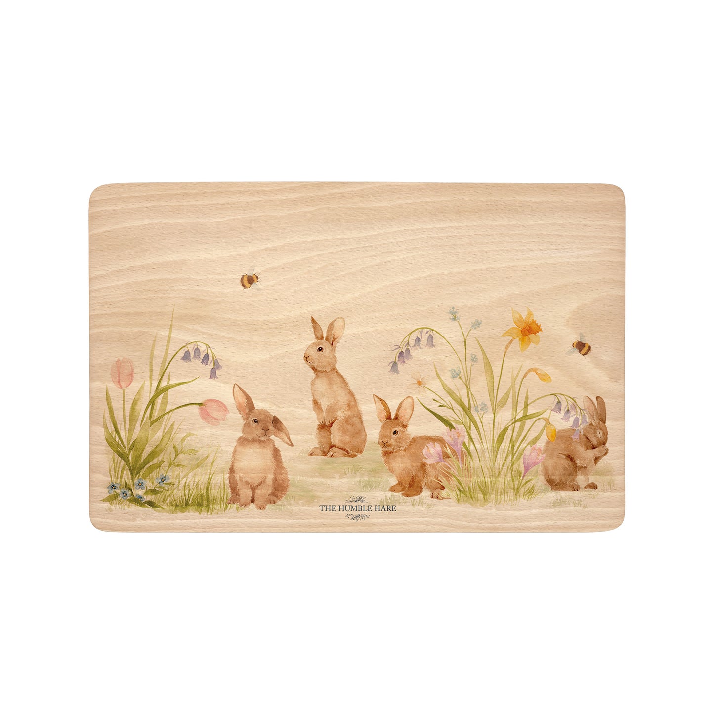 Rectangle beech wood chopping board featuring our blooming bunnies woodland animal design, with rabbits among spring flowers.
