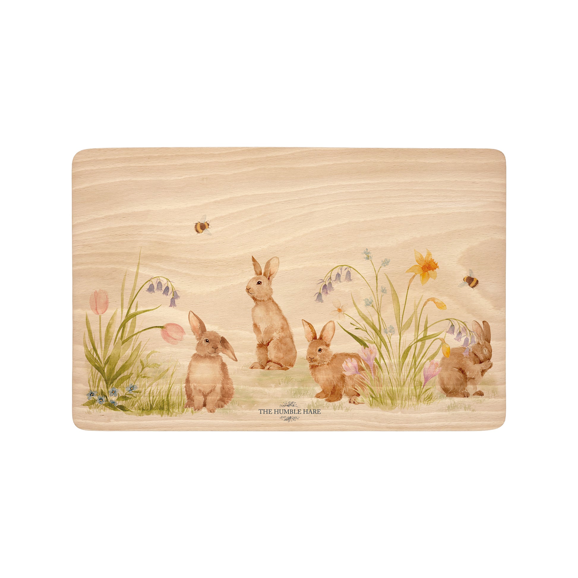 Rectangle beech wood chopping board featuring our blooming bunnies woodland animal design, with rabbits among spring flowers.