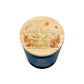 A blue glass jar candle with a round wooden lid decorated with a watercolor illustration of two rabbits, flowers, and grass, shown on a white background.