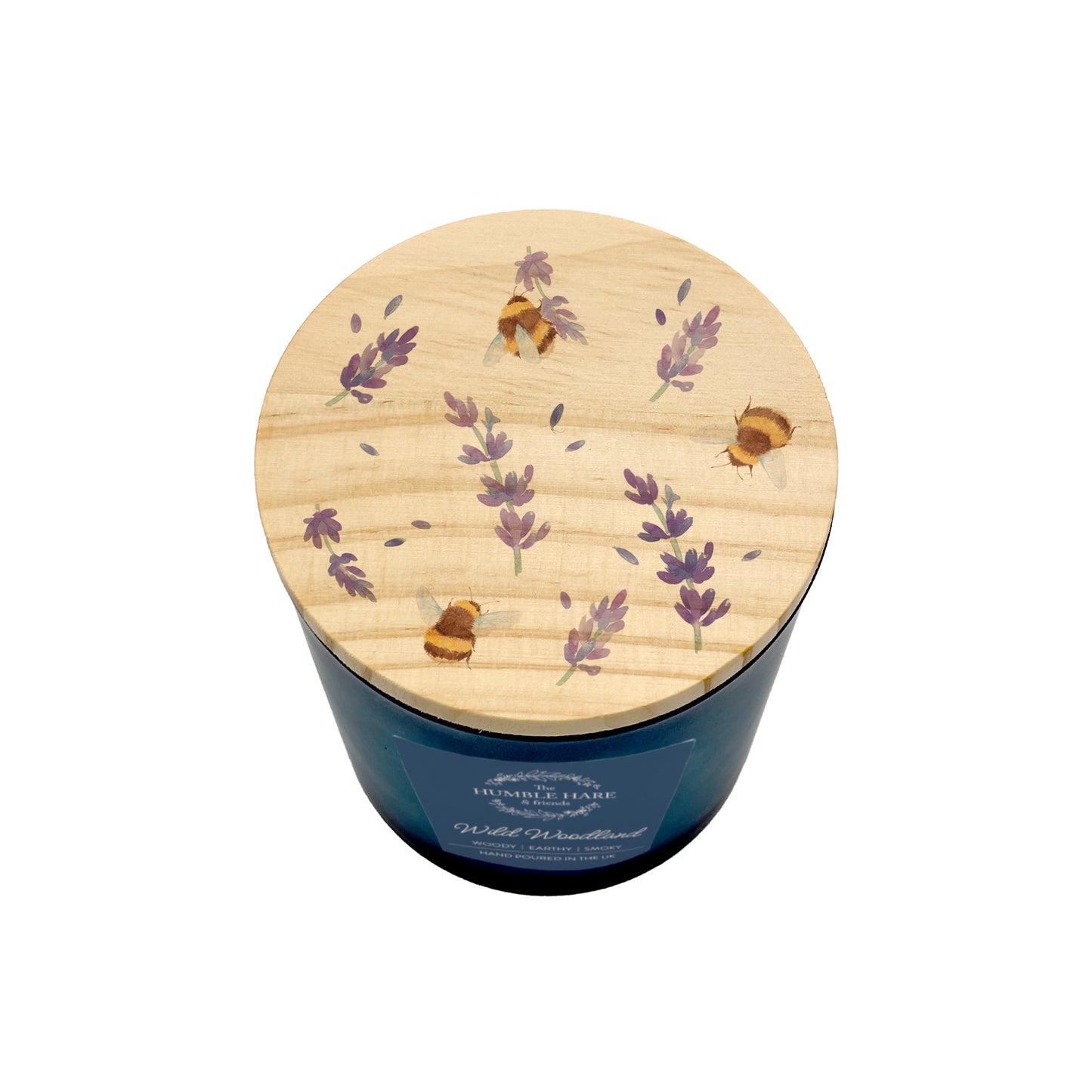 A dark blue glass jar candle with a round light wood lid decorated with lavender and bumblebees, shown on a plain white background.