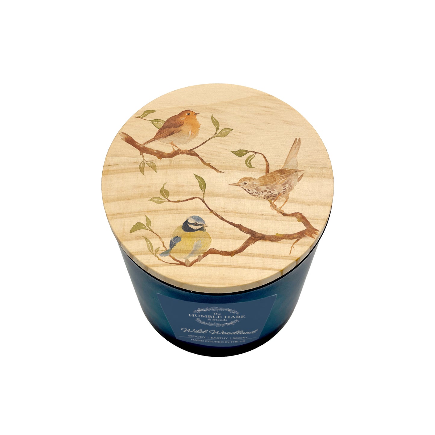 A blue glass jar candle with a round light wood lid decorated with painted birds perched on branches, shown on a plain white background.