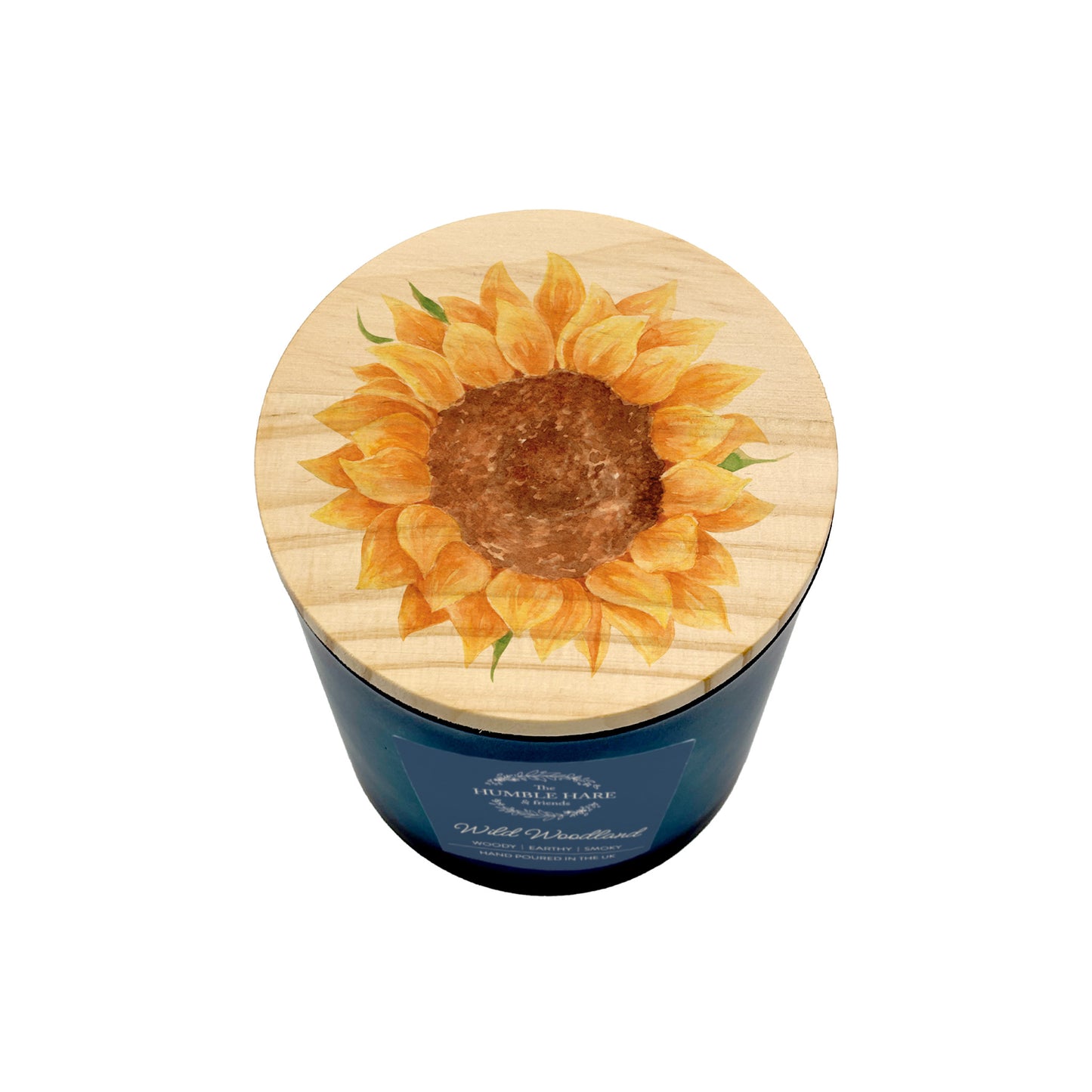 A dark blue jar candle with a round wooden lid decorated with a sunflower design, shown on a plain white background.