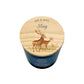 A personalised scented candle in a dark blue glass jar with a round, light wood lid with two deer and personalised Mr & Mrs text.