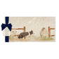 A rectangular marble sharing platter with a watercolour design of a border collie working dog herding sheep through a gate on the farm. The platter is packaged with a luxurious blue gift bow.