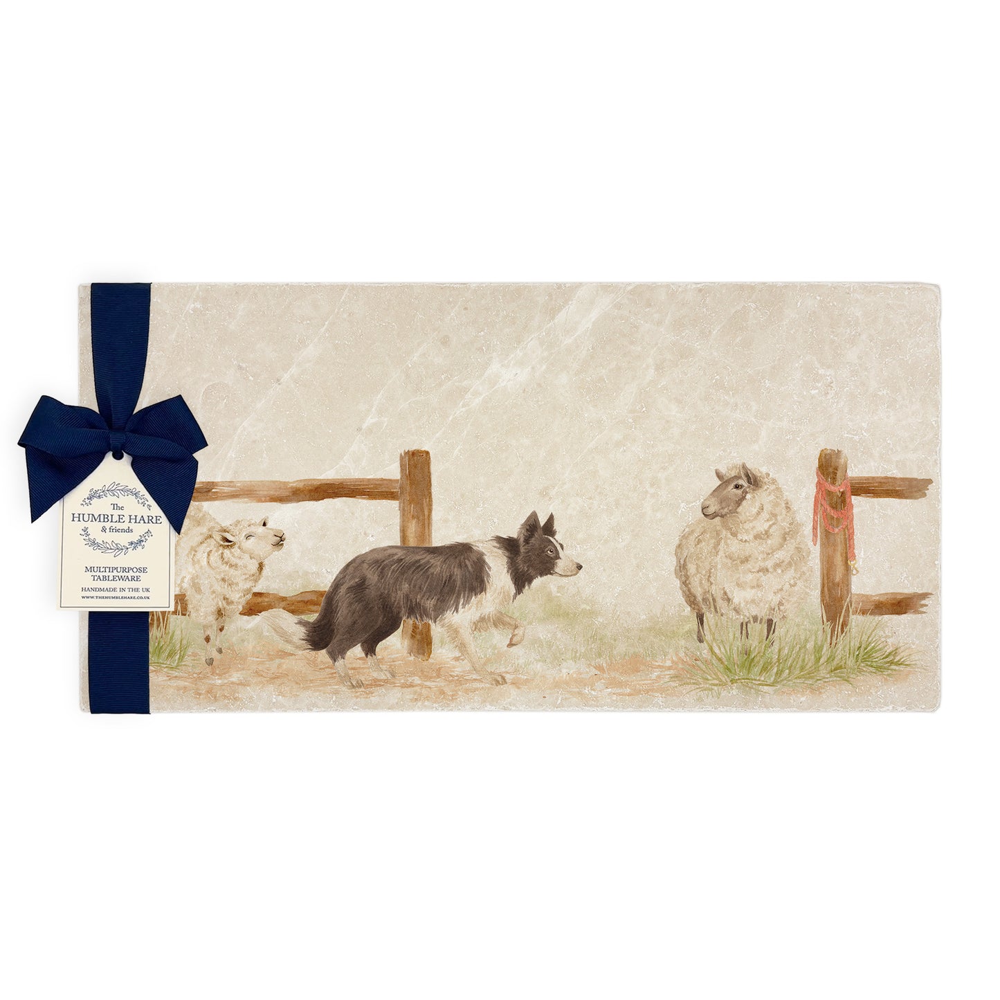 A rectangular marble sharing platter with a watercolour design of a border collie working dog herding sheep through a gate on the farm. The platter is packaged with a luxurious blue gift bow.