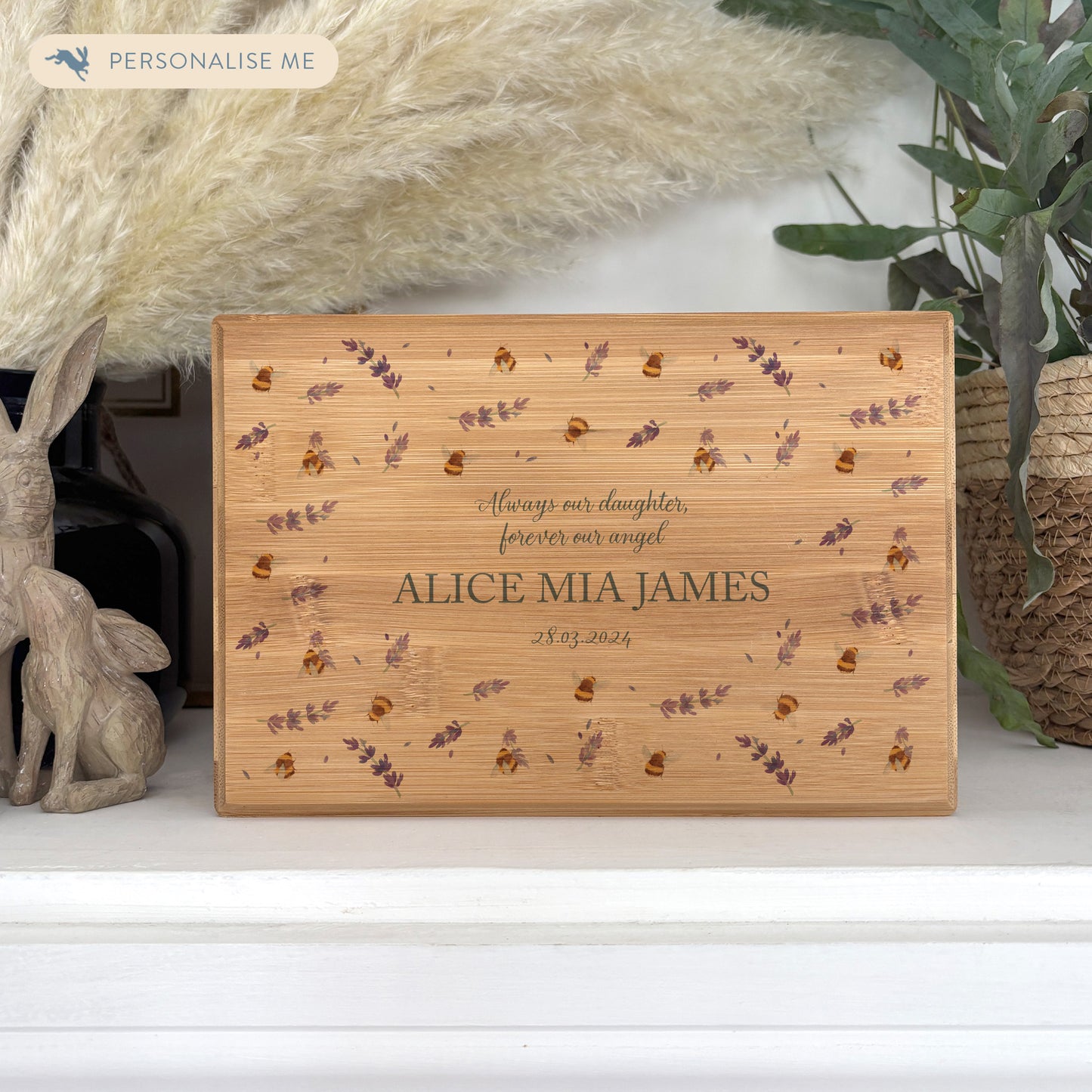 A beautifully crafted solid Bamboo wooden urn, personalised and finished with a soft watercolour design of Buzzy Bees and lavender, Thoughtfully made for either display or burial, this personalised urn can be customised to create a meaningful memorial. Perfect for holding ashes of a loved one or a beloved pet, it serves as a comforting tribute and keepsake. 