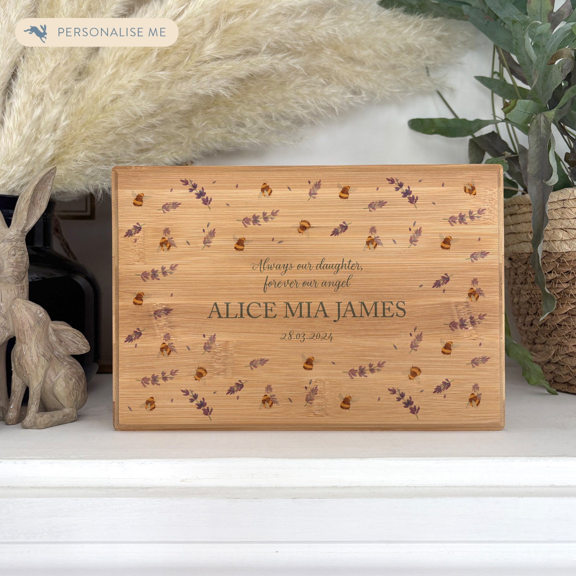 A beautifully crafted solid Bamboo wooden urn, personalised and finished with a soft watercolour design of Buzzy Bees and lavender, Thoughtfully made for either display or burial, this personalised urn can be customised to create a meaningful memorial. Perfect for holding ashes of a loved one or a beloved pet, it serves as a comforting tribute and keepsake. 